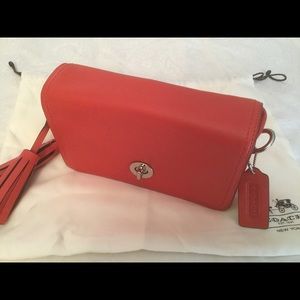 NWOT Coach Legacy Penny coral leather turn lock crossbody.